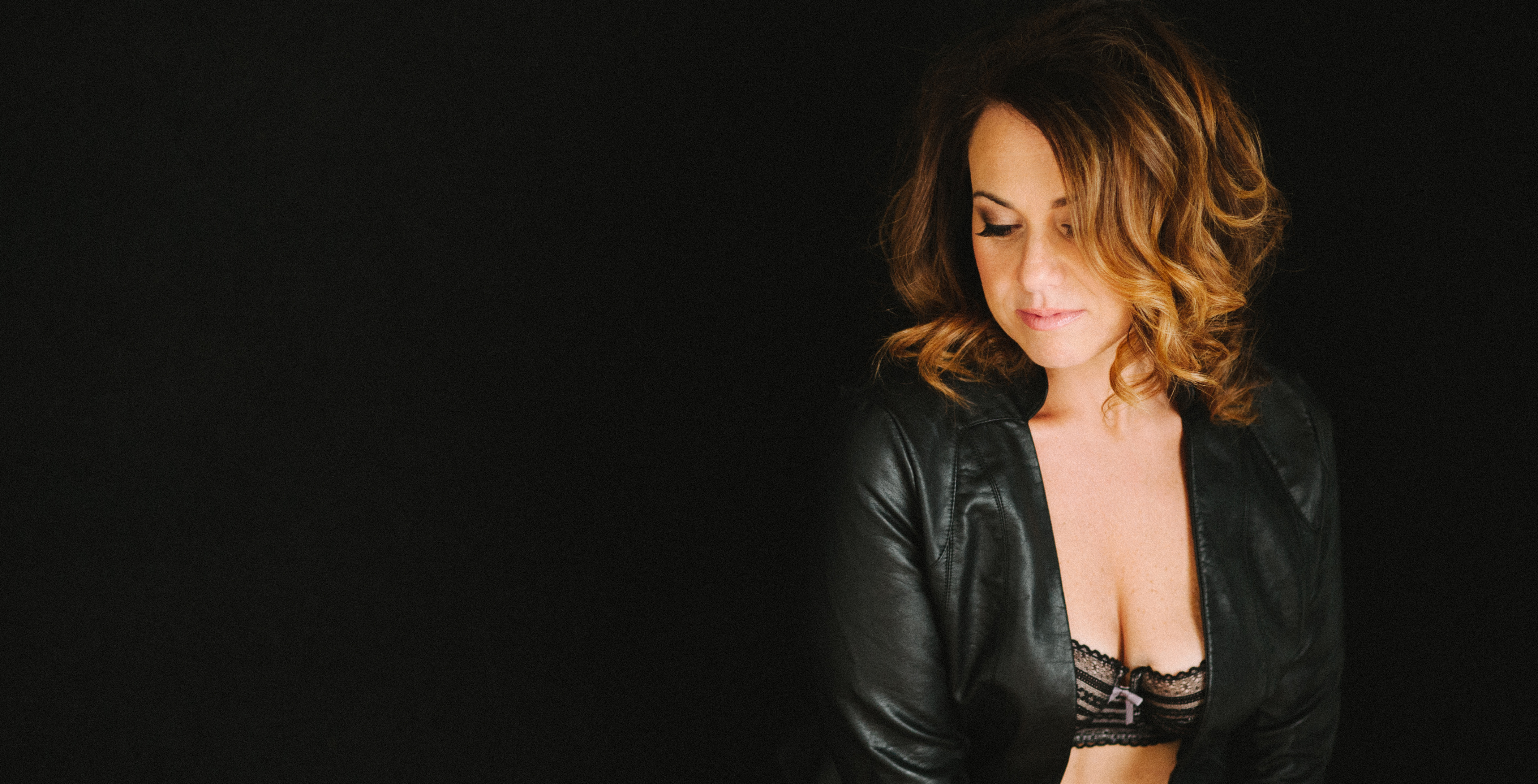 boudoir portrait with leather jacket by Carmen Salazar - Roseville Boudour Photographer