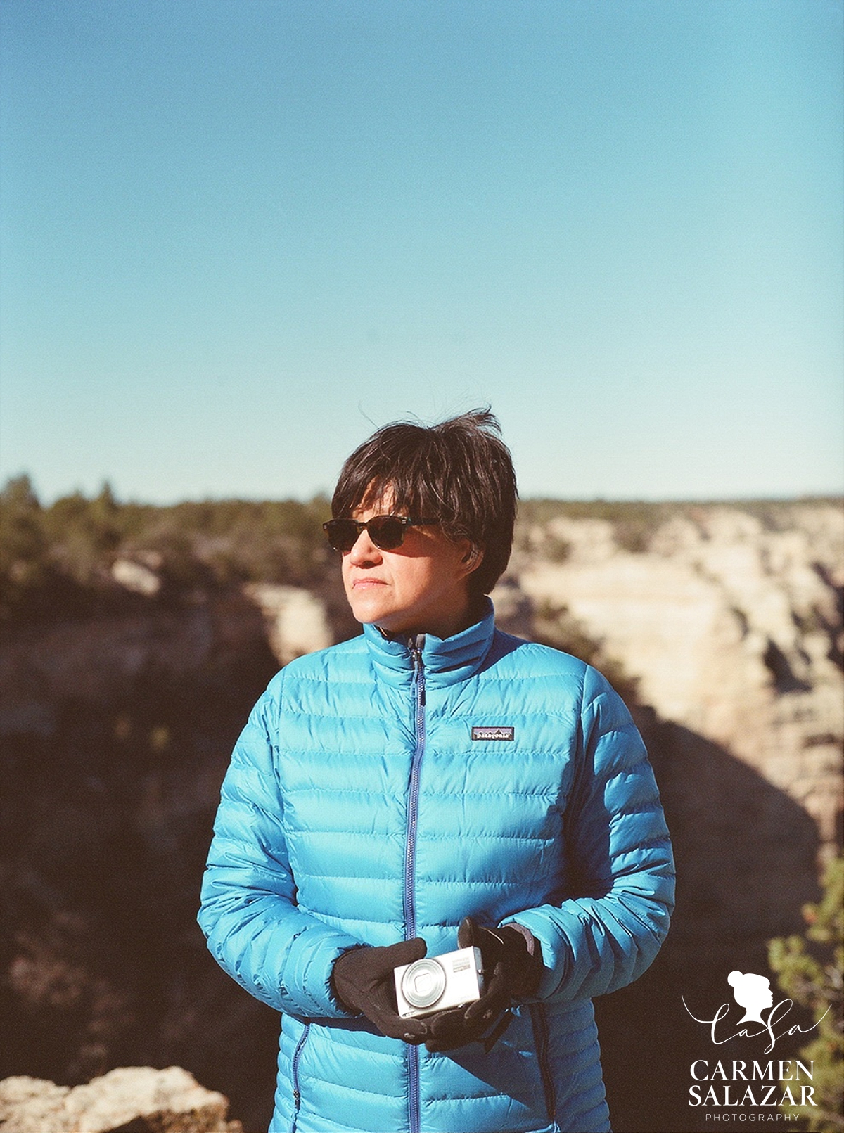 portrait of woman at grand canyon with camera by Carmen Salazar