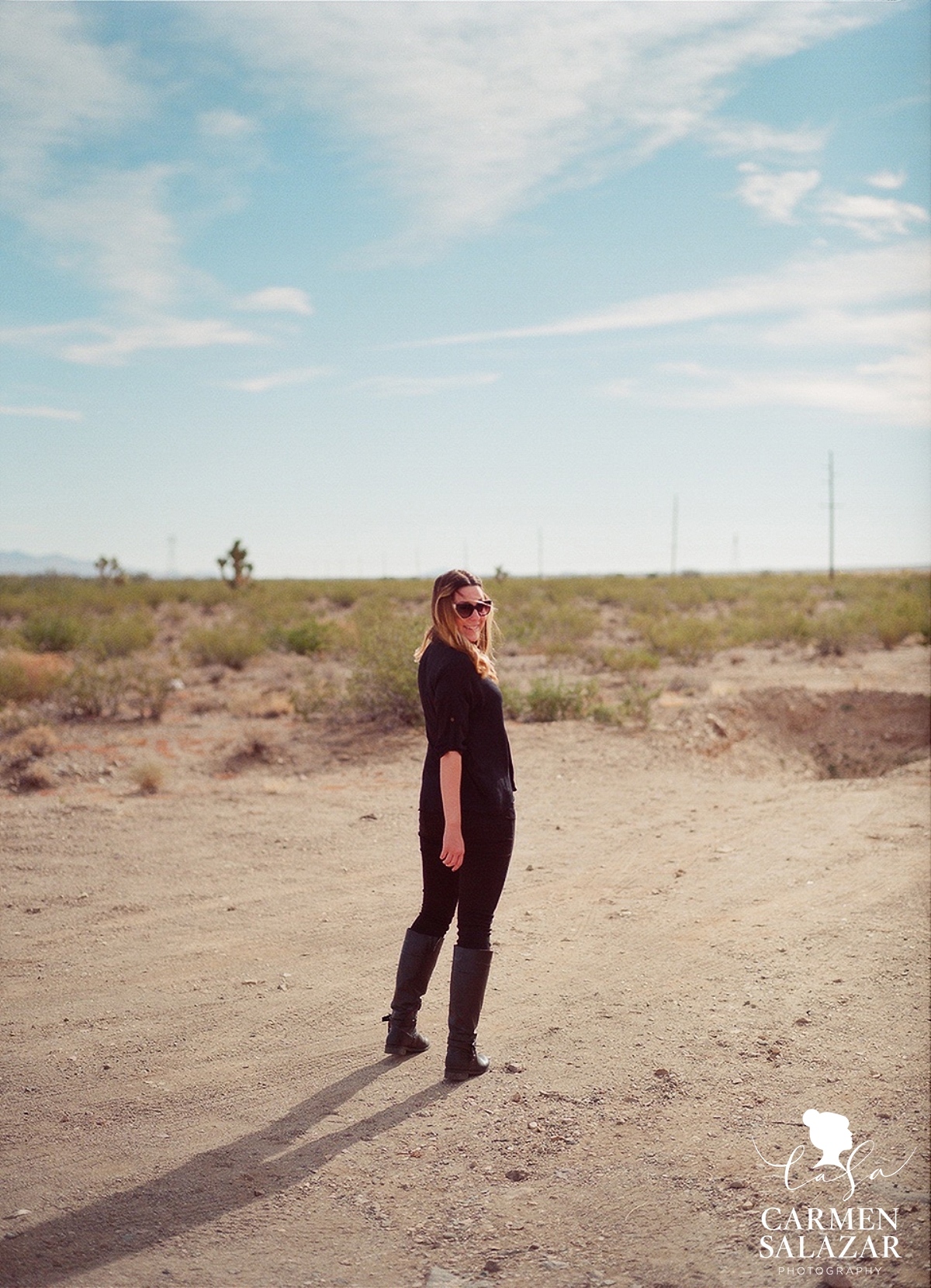 fun portrait of blond girl in the desert by Carmen Salazar Photography