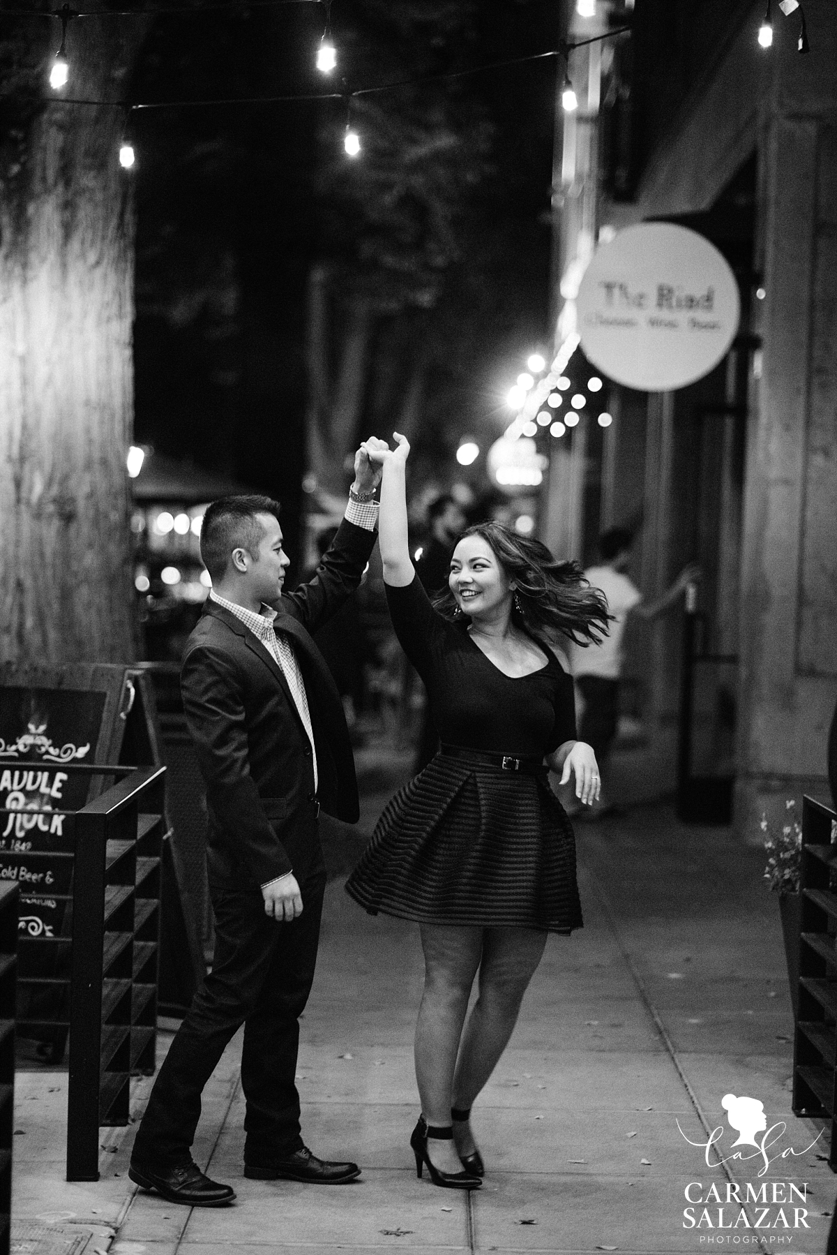 Couple dancing in Downtown engagement session - Carmen Salazar