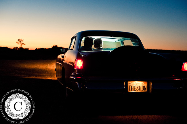 kissing in vintage car engagement photography