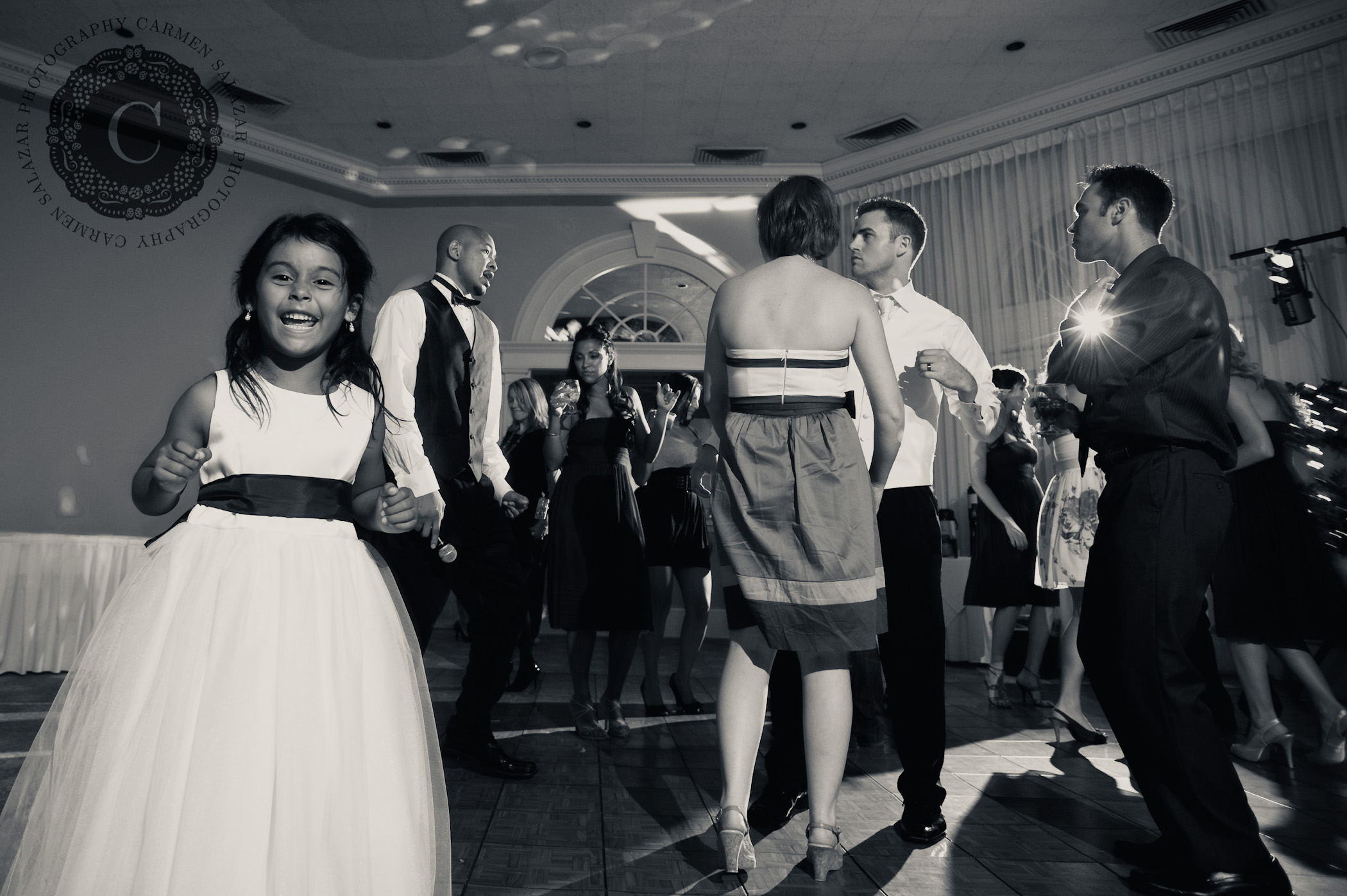 Sweet flower girl having fun at wedding party 