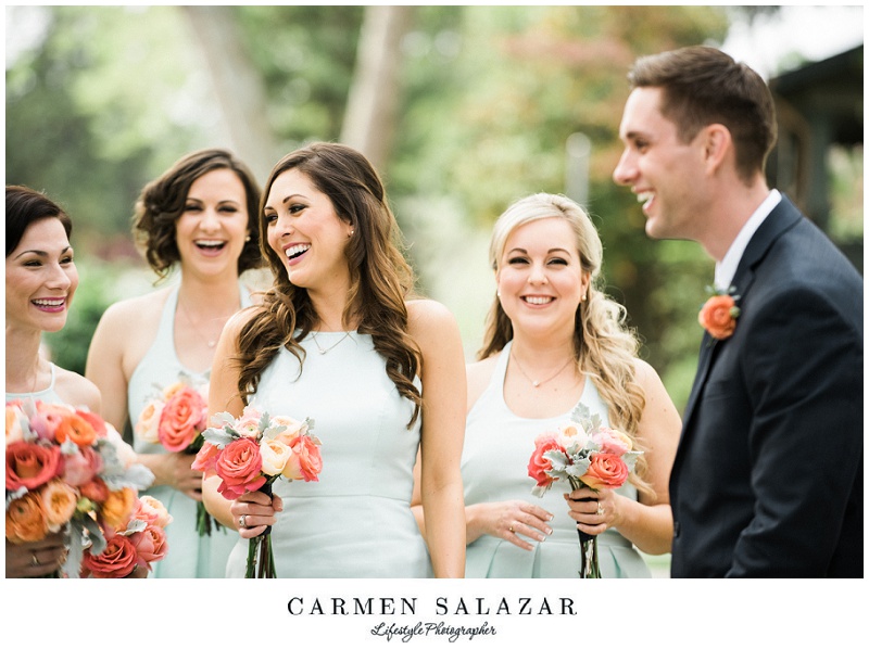 Laughing bridesmaids photo with groom