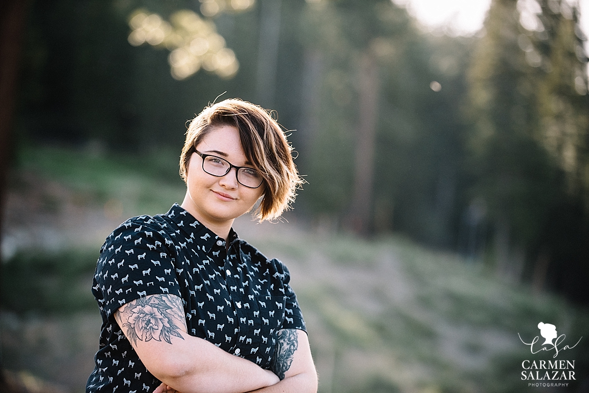 Outdoor headshot of woman with tatoos