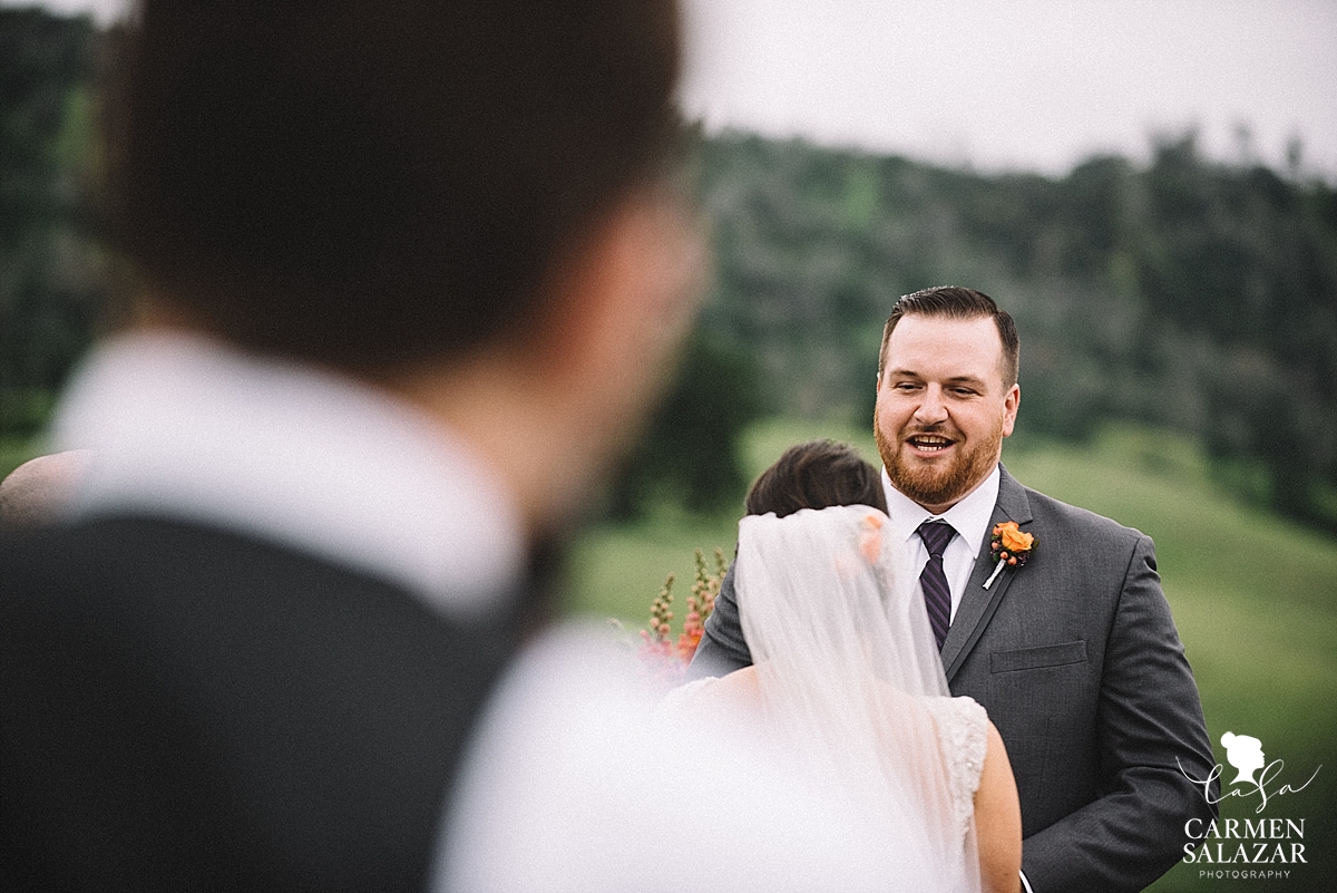 Emotional groom saying vows - Carmen Salazar