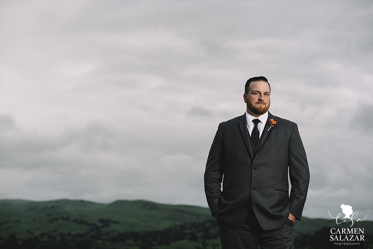 Dashing groom against night sky - Carmen Salazar