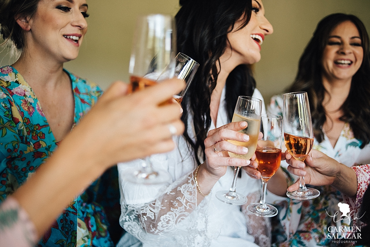 Fun bridesmaids toasting at Field & Pond