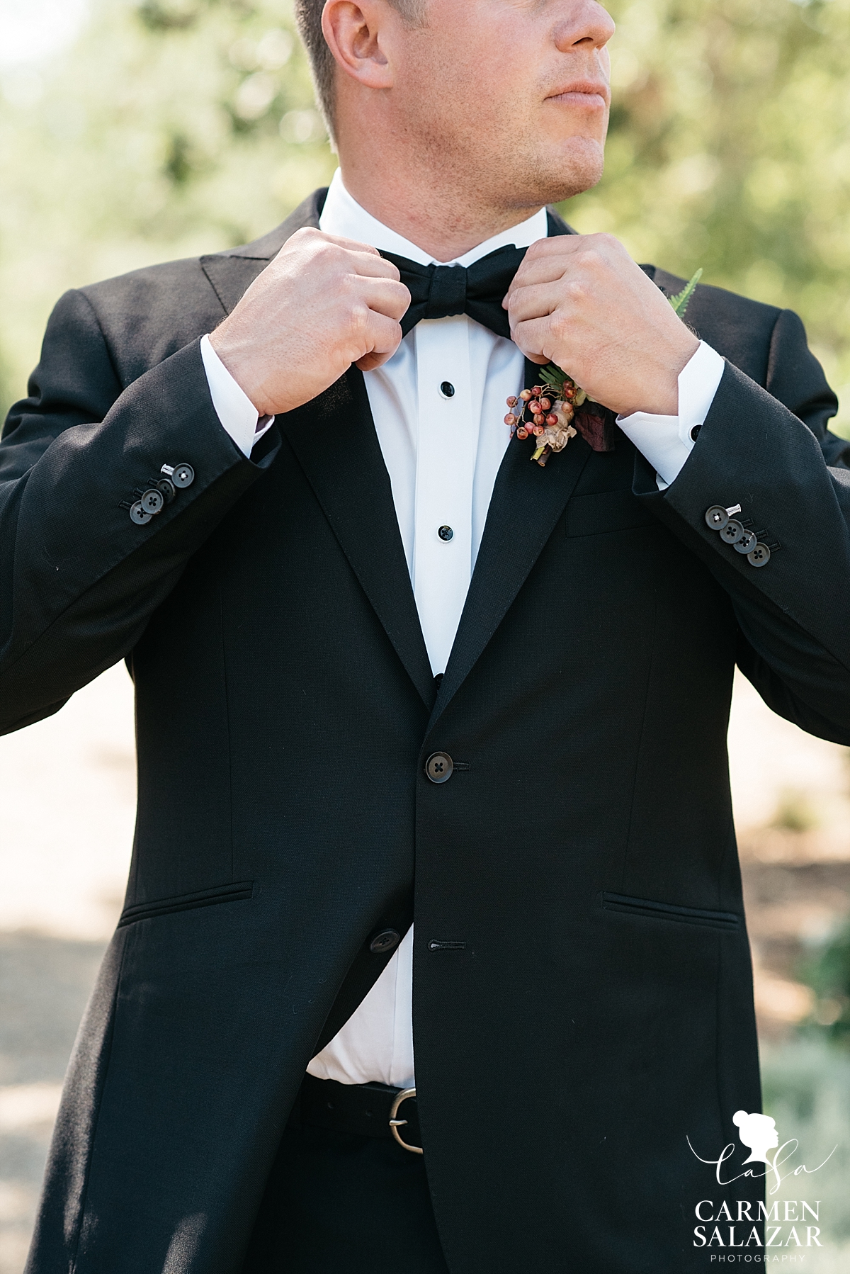 Groom getting ready for first look at bride 