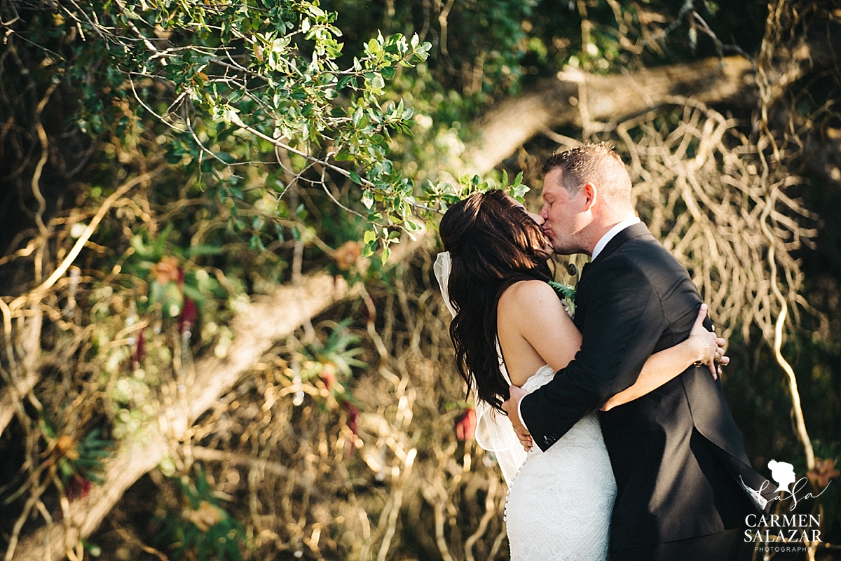 First kiss at boho Field & Pond wedding - Carmen Salazar