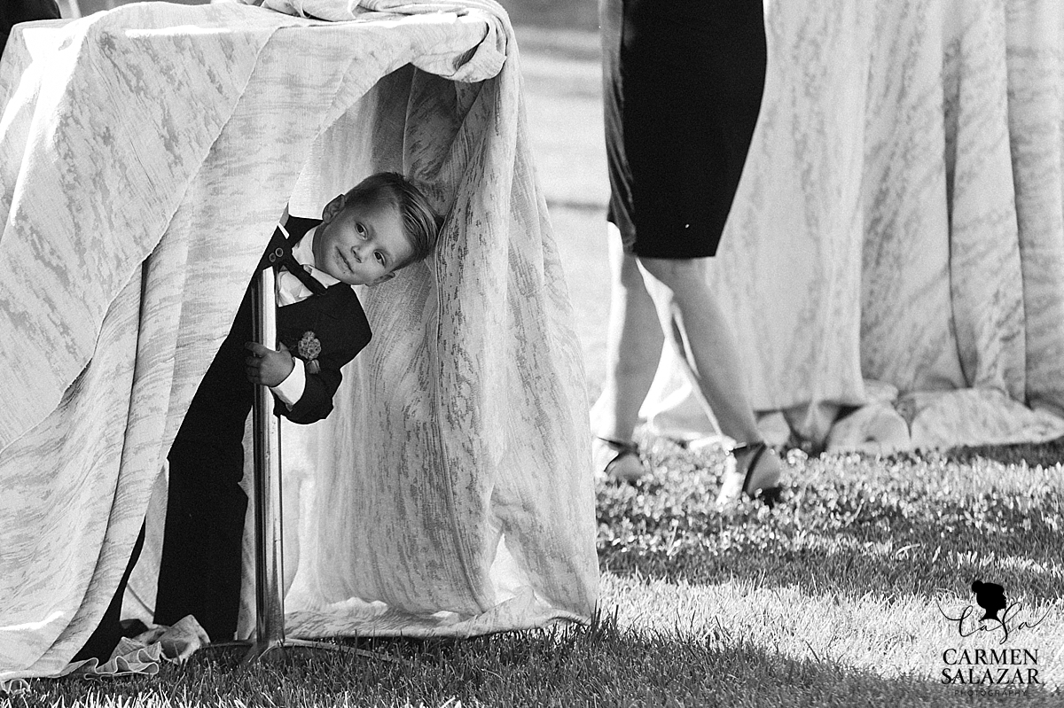 Playful ring bearer at Field & Pond - Carmen Salazar