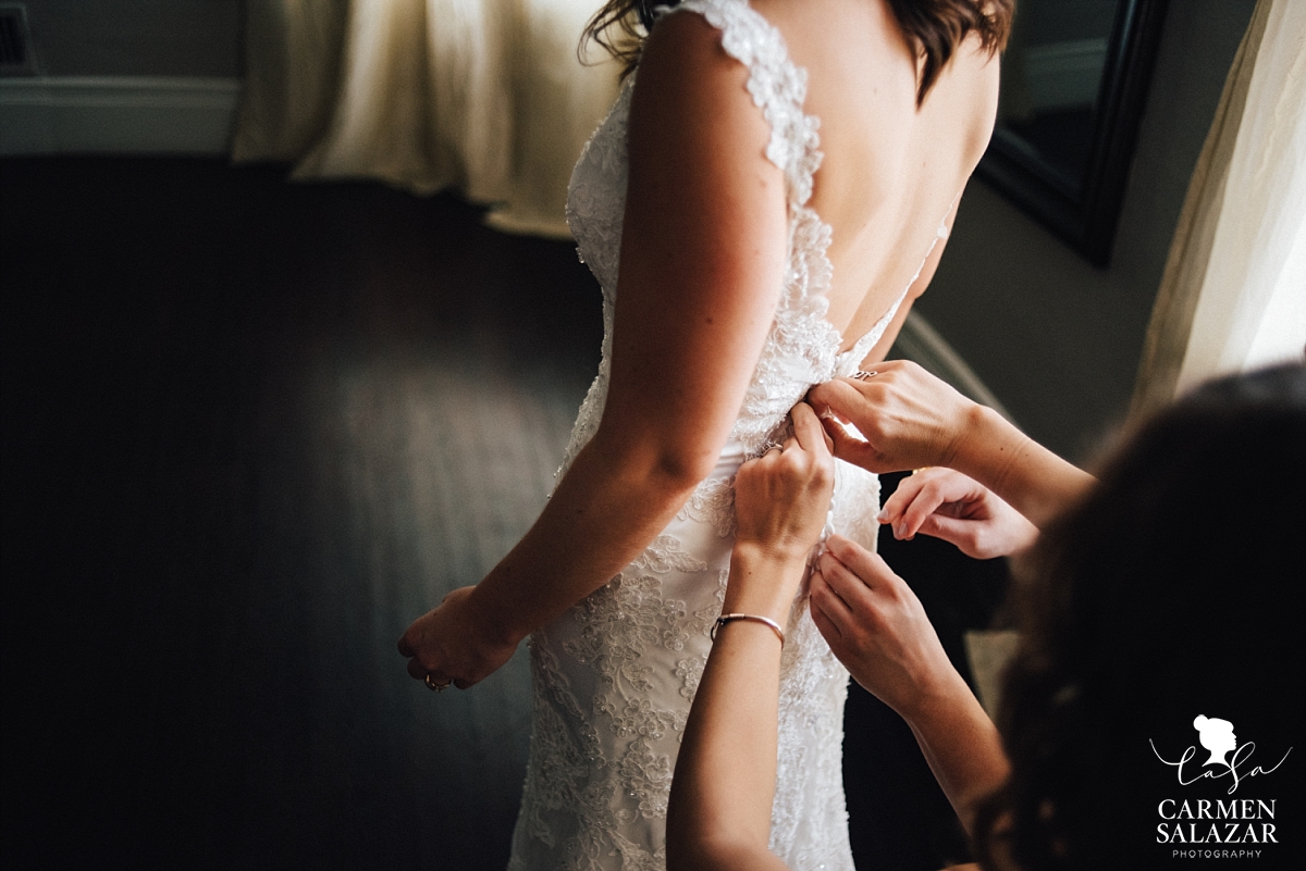 Buttoning the vintage lace gown - Carmen Salazar