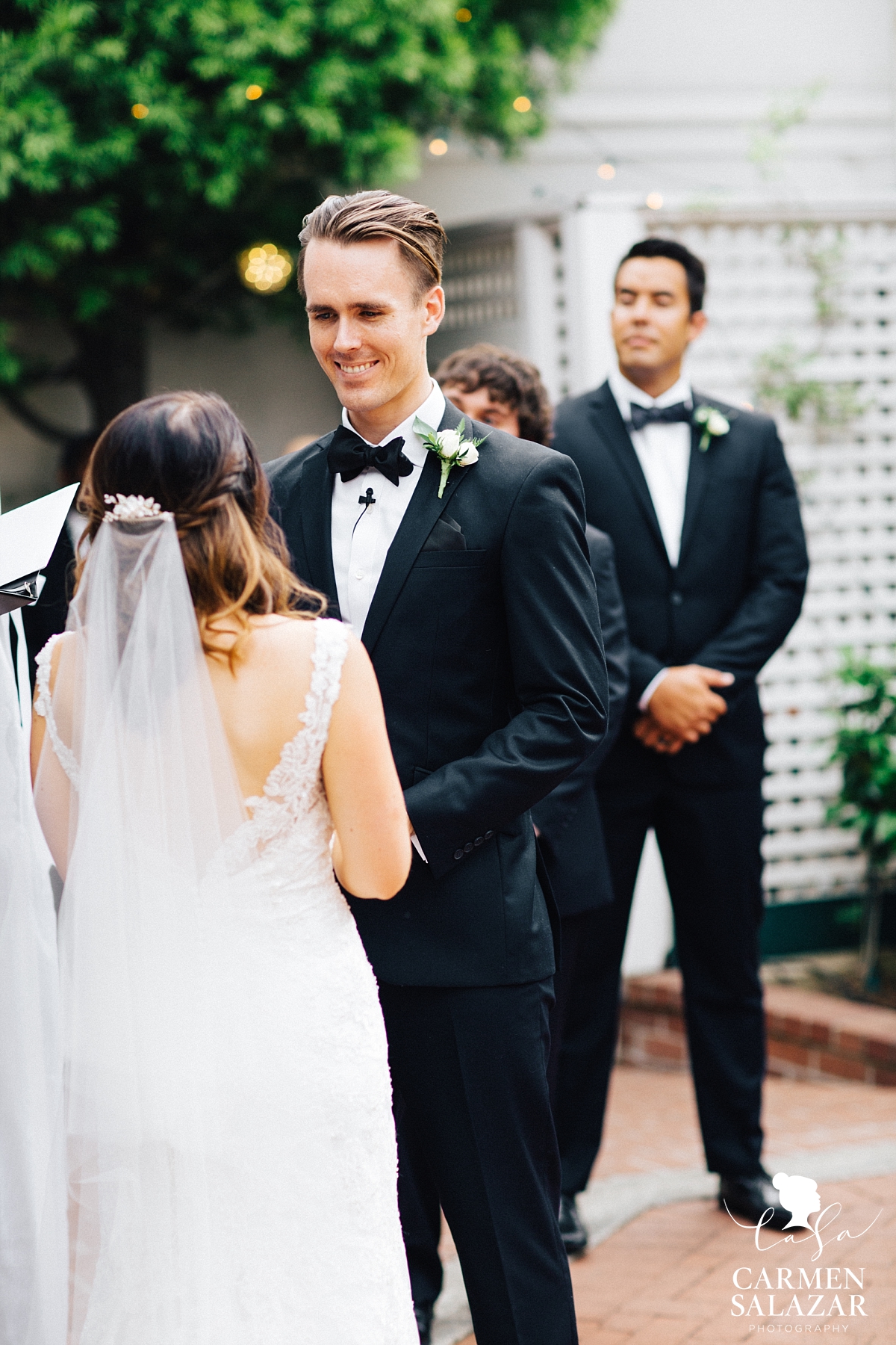 Handsome groom at ceremony - Carmen Salazar