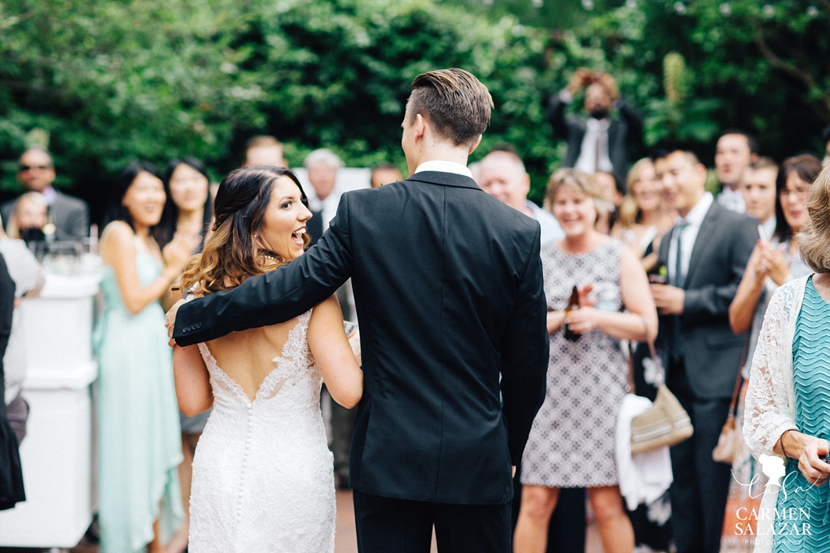 Excited bride at cocktail hour at outdoor Sacramento wedding