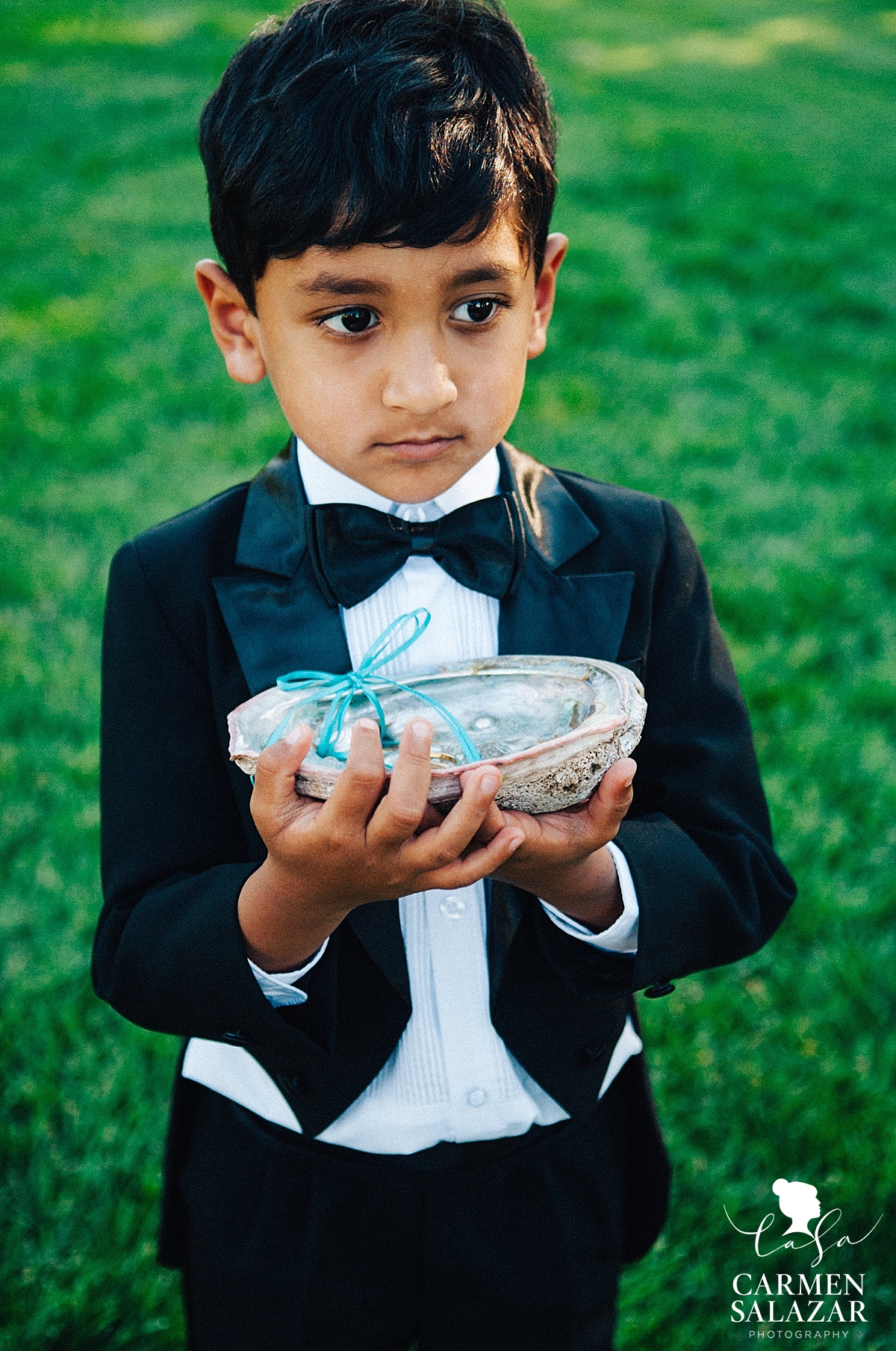 Adorable ring bearer with abalone shell - Carmen Salazar