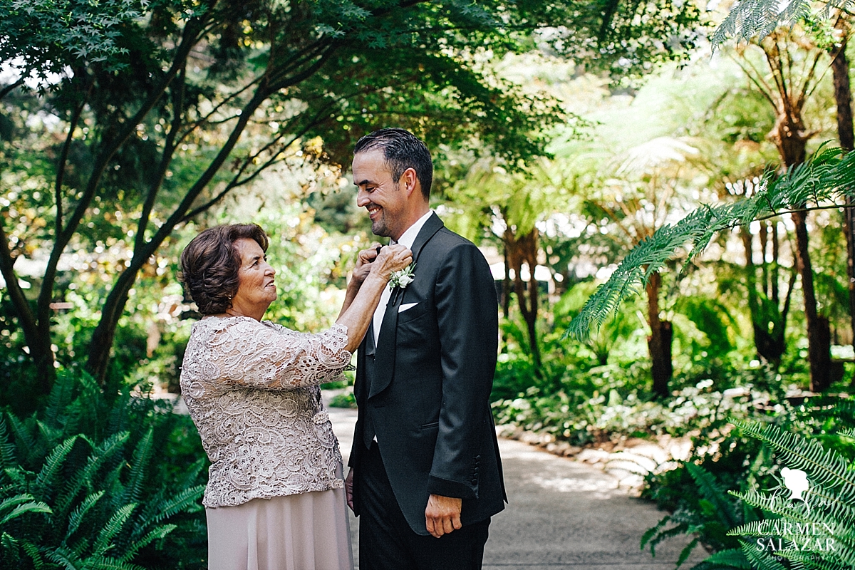 Mother of the groom tying bow tie at Wine and Roses wedding - Carmen Salazar