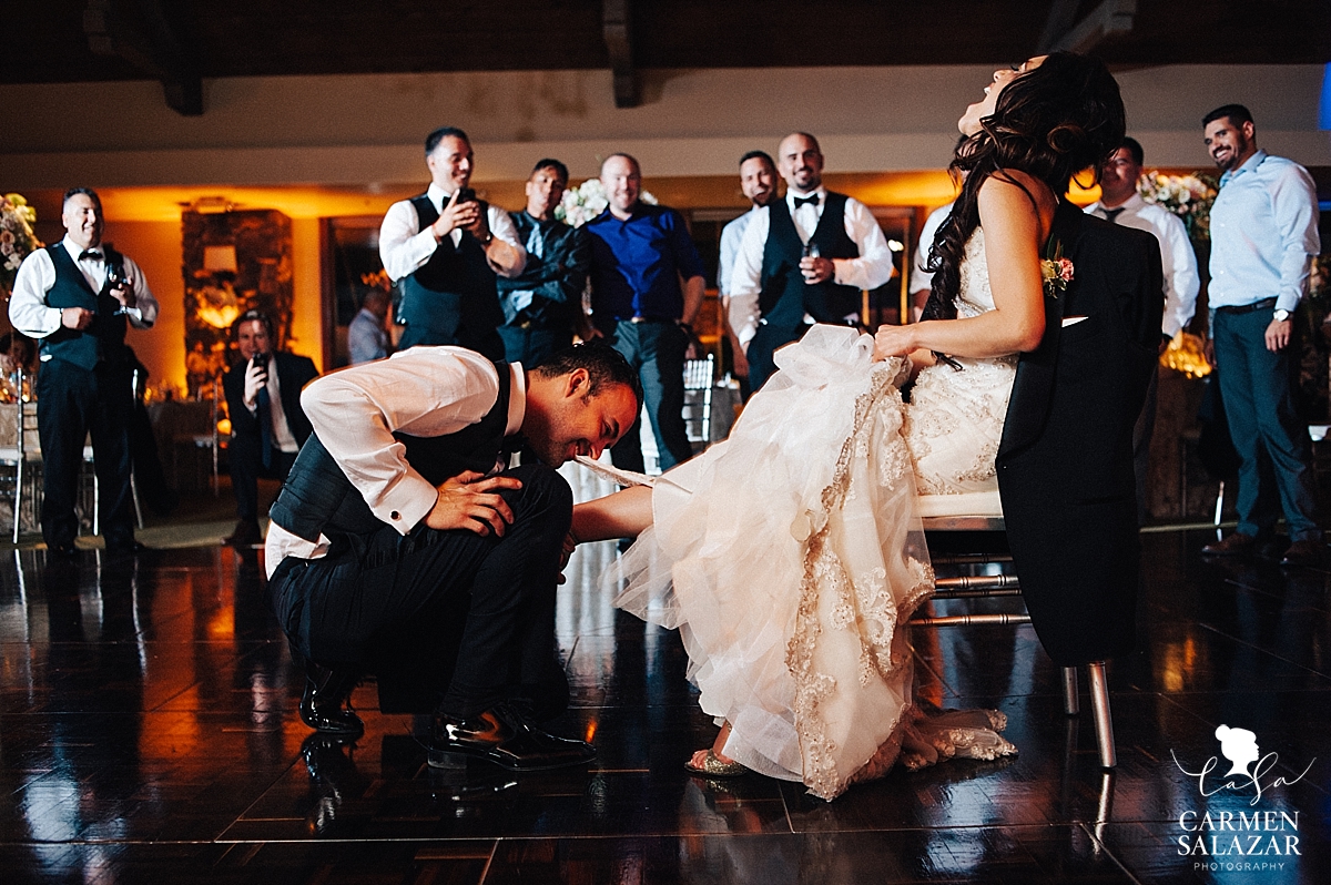 Garter toss at Lodi ballroom wedding reception - Carmen Salazar