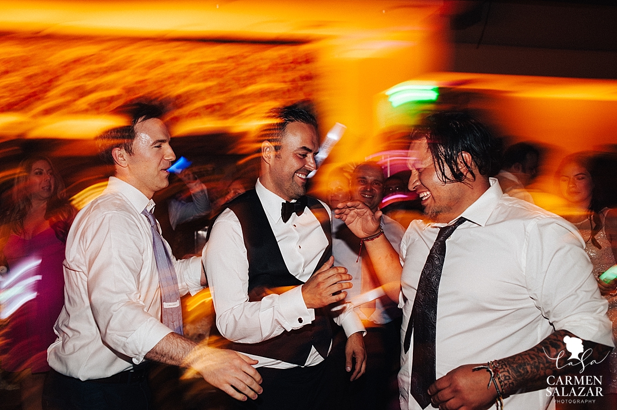 Groom dancing with guests at Wine and Roses reception - Carmen Salazar