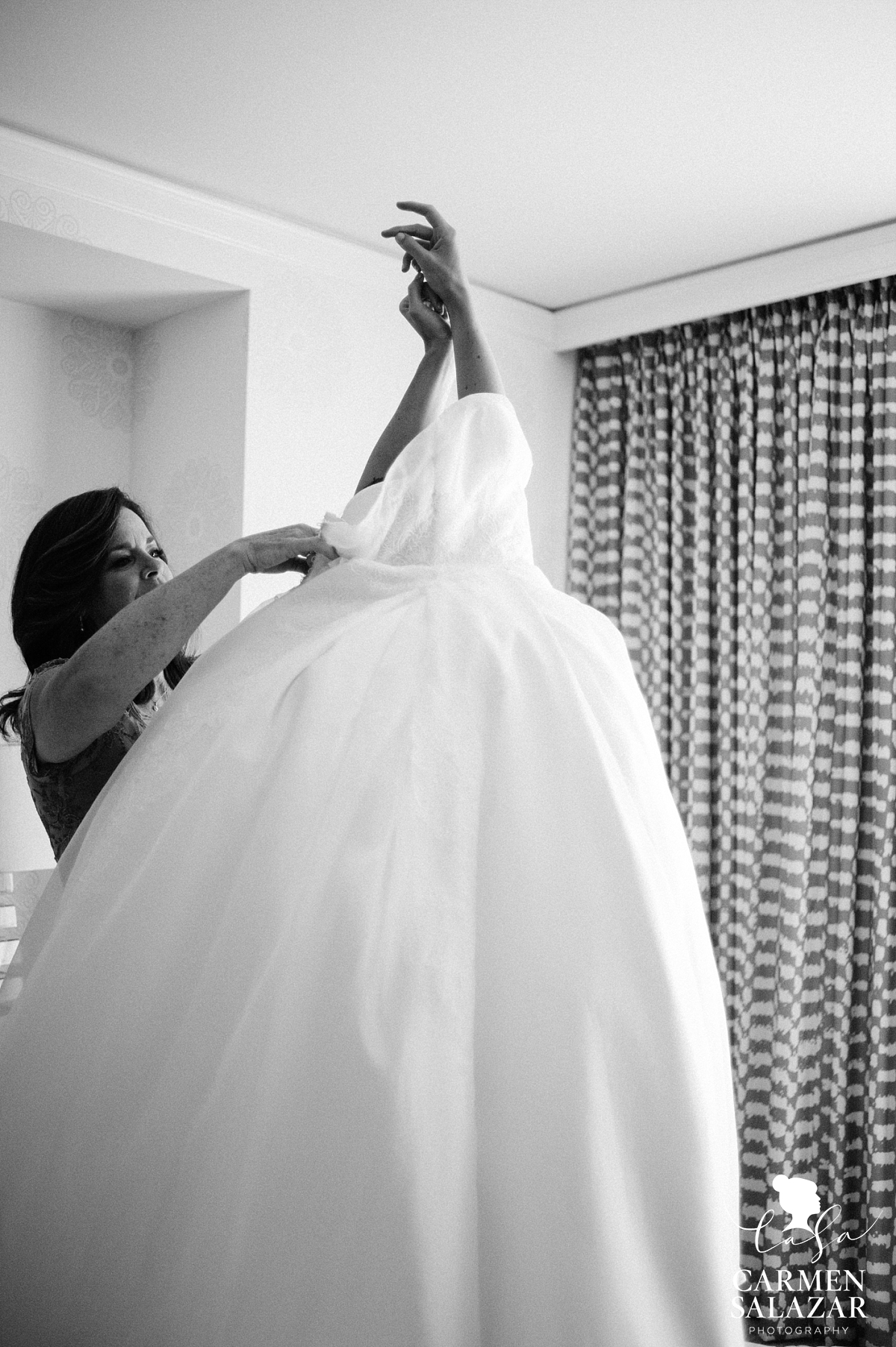 Bride getting dressed at Fairmont- Carmen Salazar