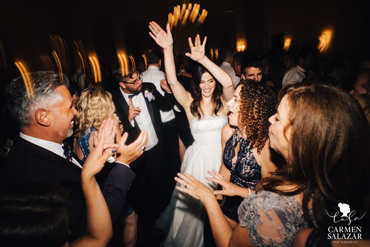 Beautiful bride dancing with friends - Carmen Salazar