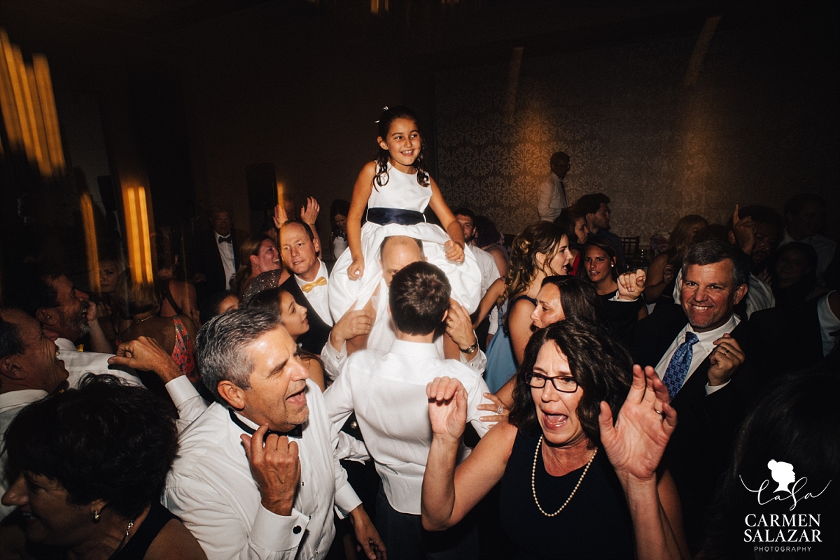 Flowergirl running the dance floor on shoulders - Carmen Salazar