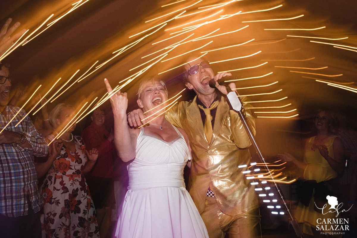 Bride singing with Pop Rocks cover band at Chalet View Lodge reception - Carmen Salazar