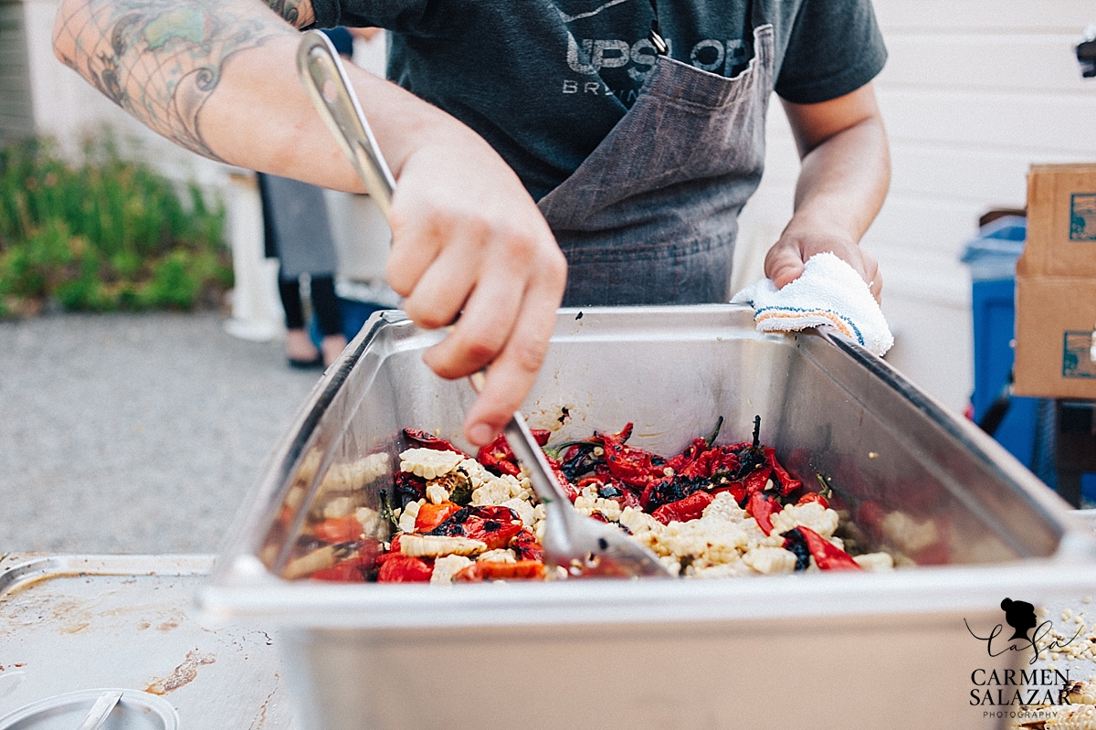 Catering behind the scenes photo of a chef at a wedding - Carmen Salazar