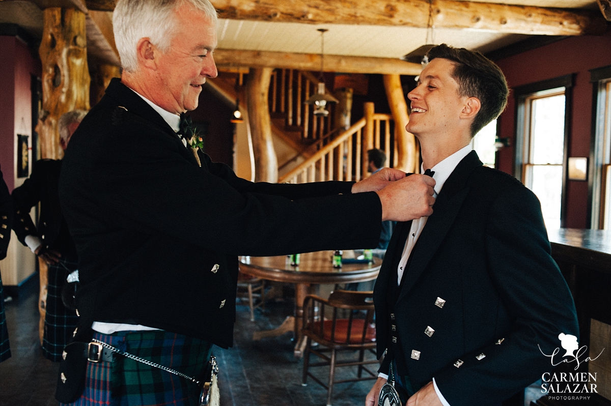 Father of the bride helping groom get ready - Carmen Salazar