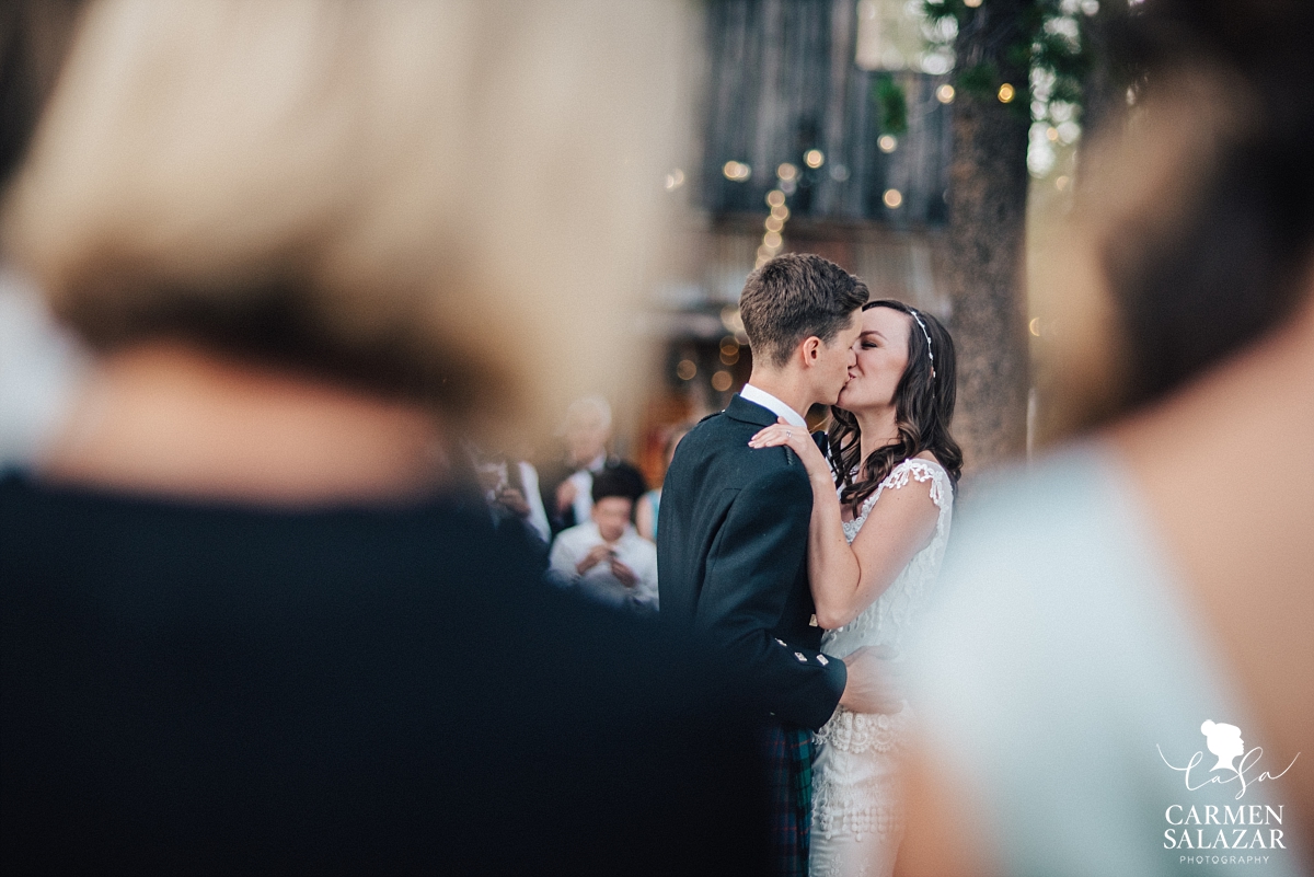 Wedding cake kiss at summer Tahoe reception - Carmen Salazar