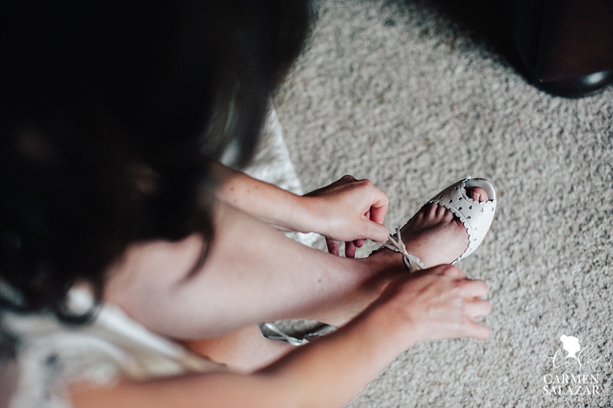 Putting on wedding shoes at The Hideout - Carmen Salazar