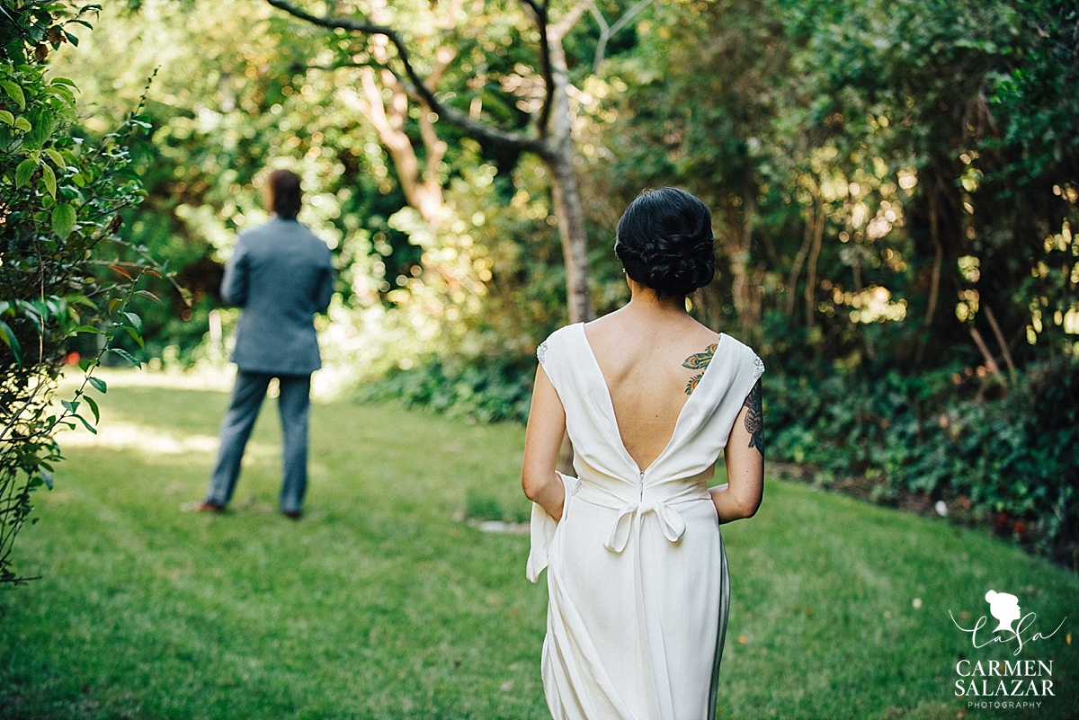 Tattooed bride walking to first look with groom - Carmen Salazar