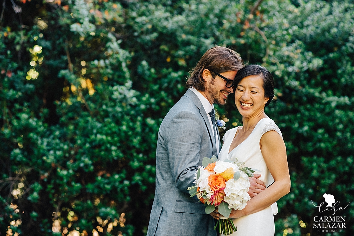 Romantic outdoor photo of laughing bride and groom at a California wedding - Carmen Salazar