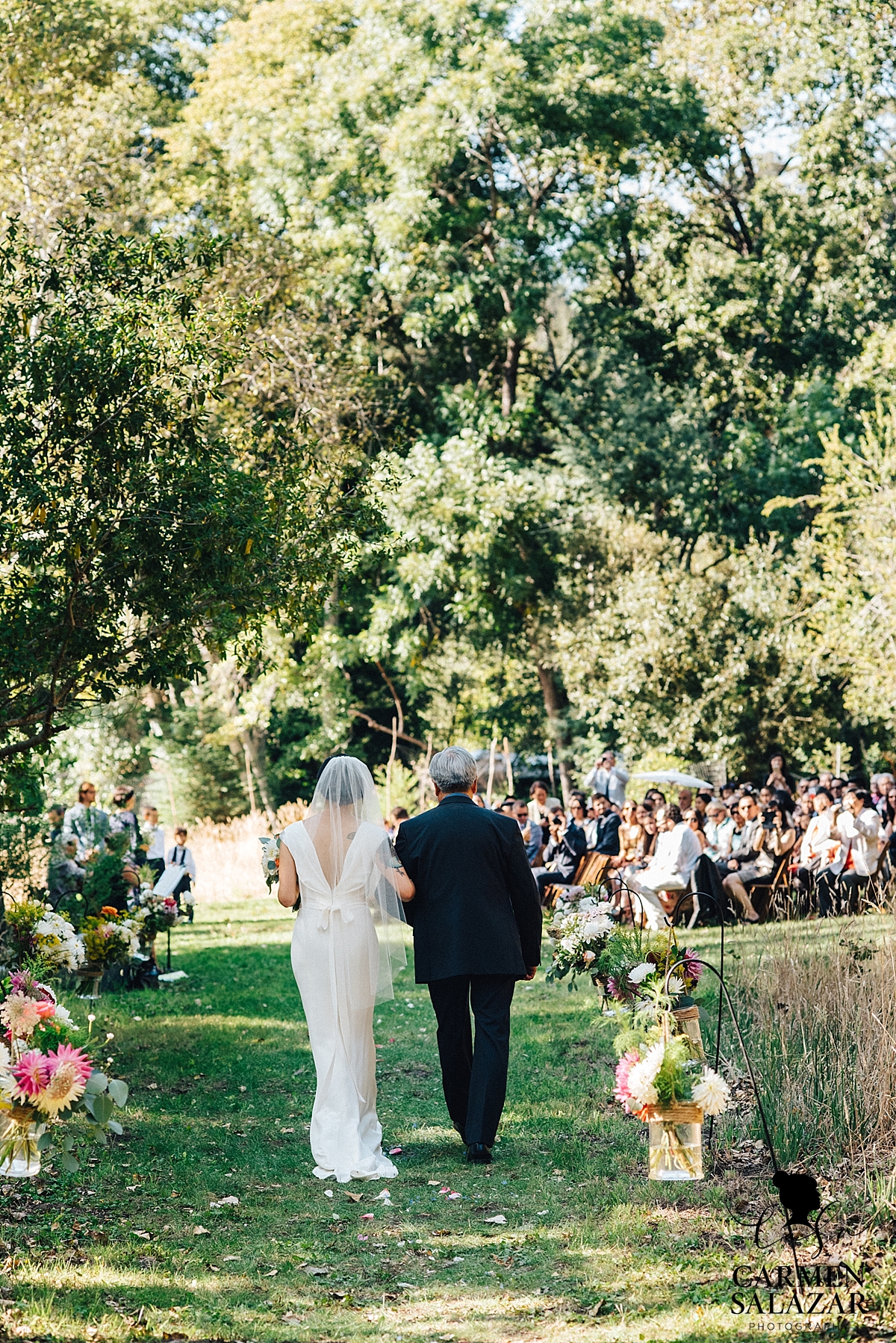 Father walking bride down floral aisle - Carmen Salazar