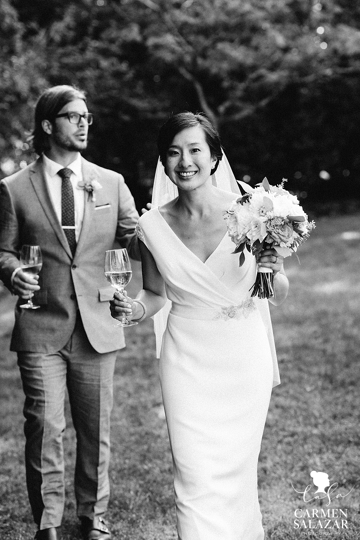 Black and white portrait of Bride and groom drinking California wine - Carmen Salazar