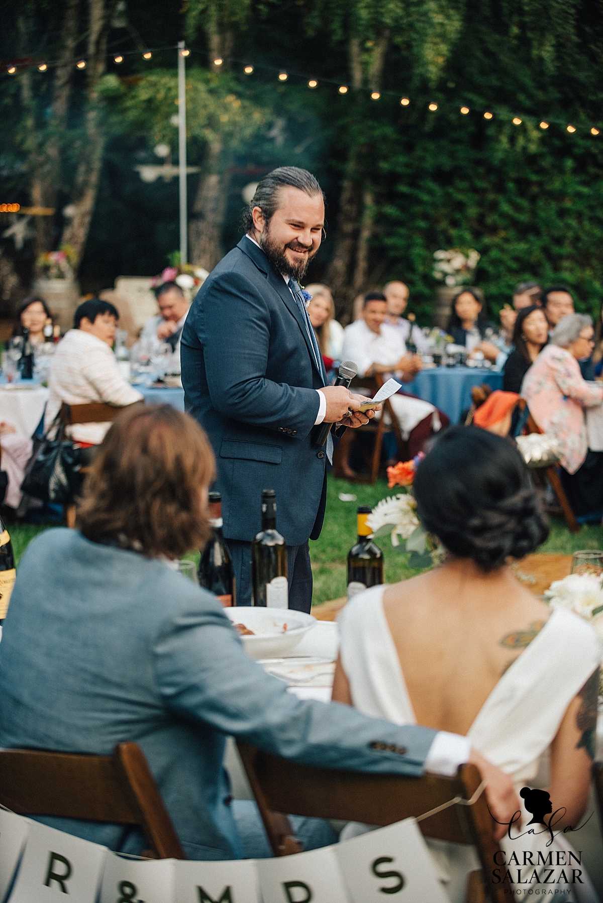 laughing best man giving sweet speech at wedding reception - Carmen Salazar