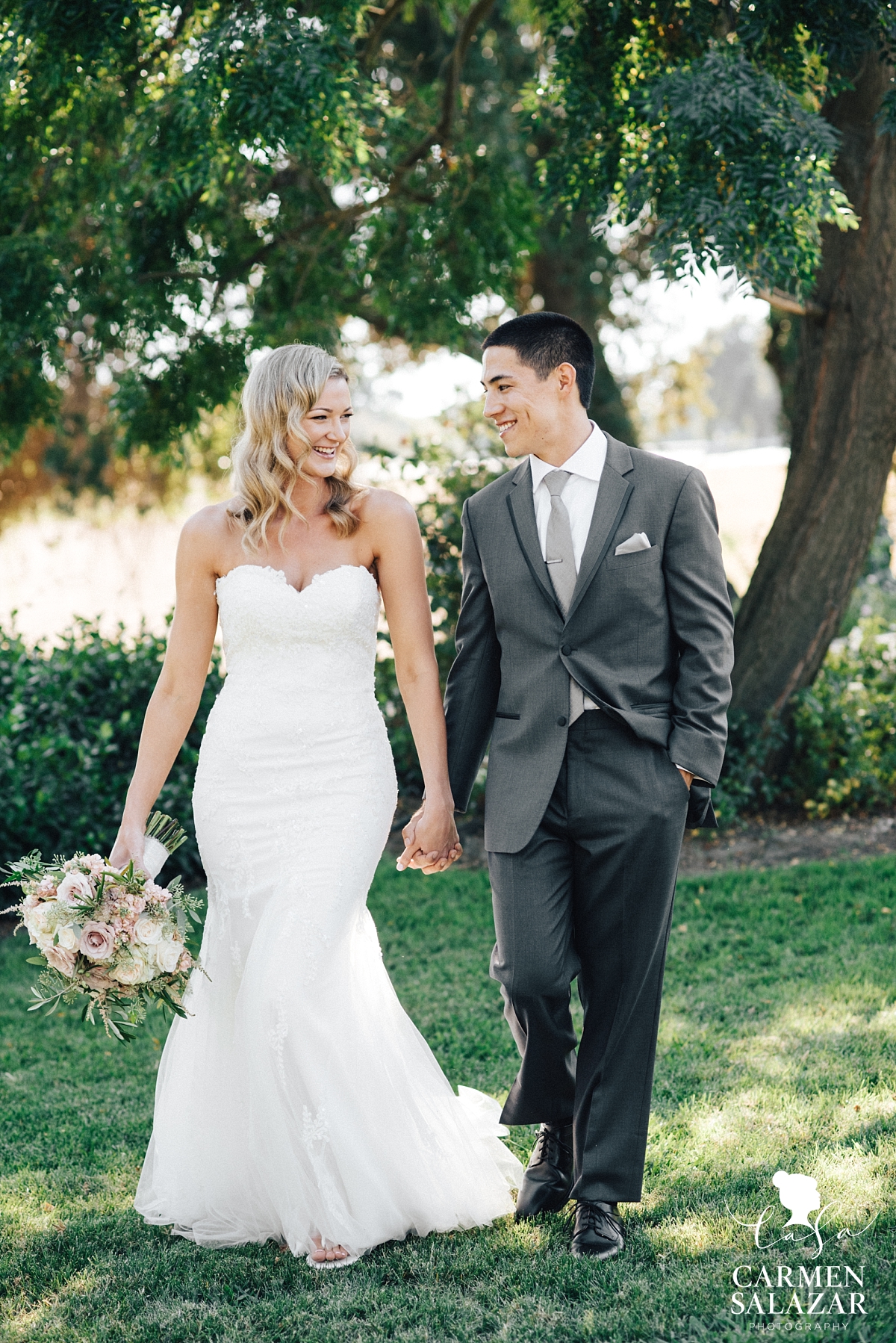 Sweet bride and groom at summer Scribner Bend winery wedding - Carmen Salazar