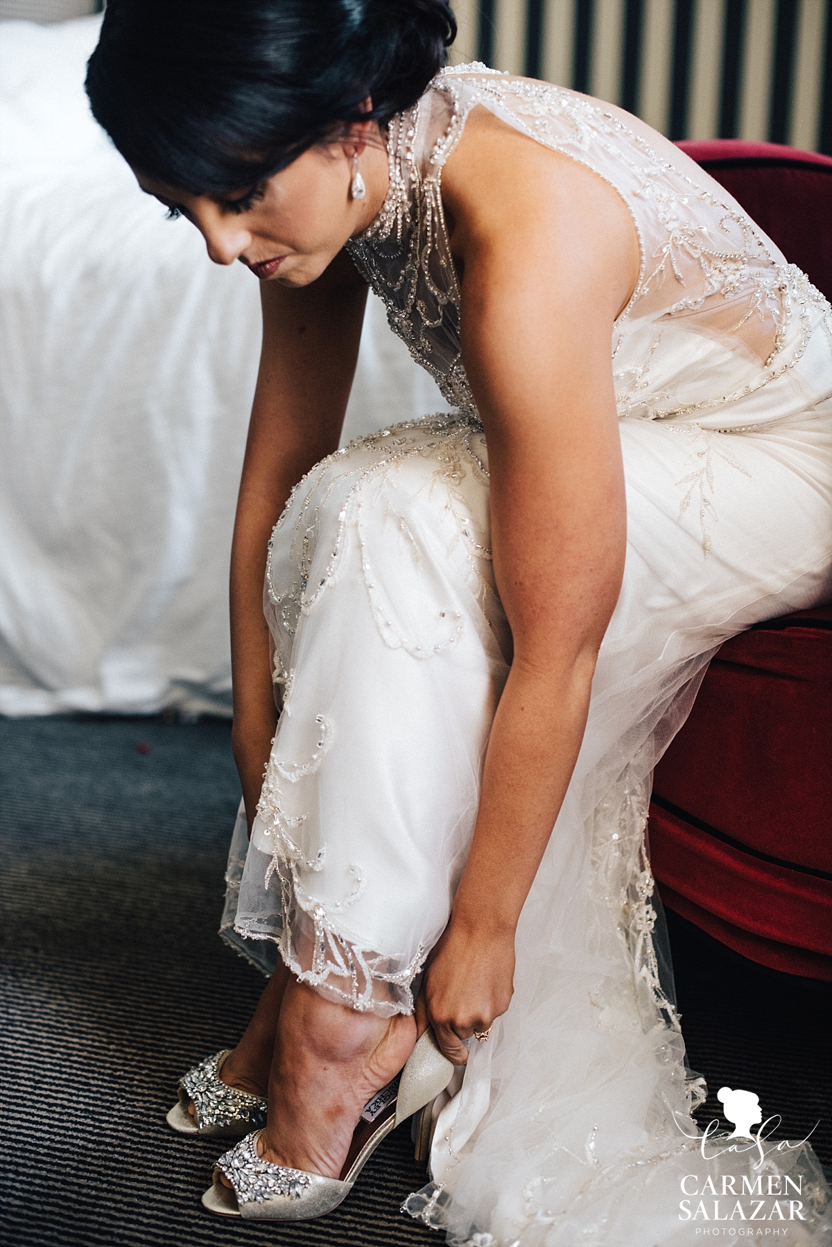 Bride putting on shoes at The Citizen - Carmen Salazar