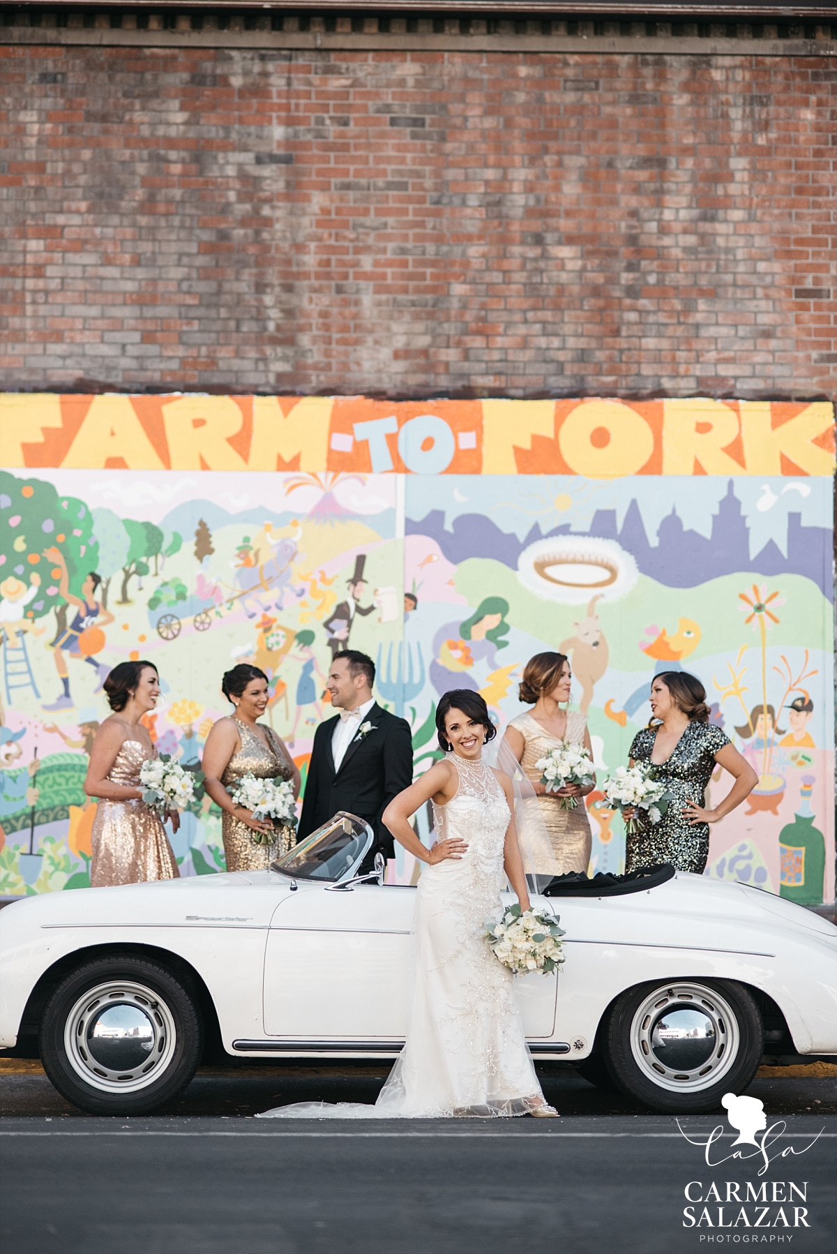 Bride and bridesmaids posing with vintage Porsche - Carmen Salazar