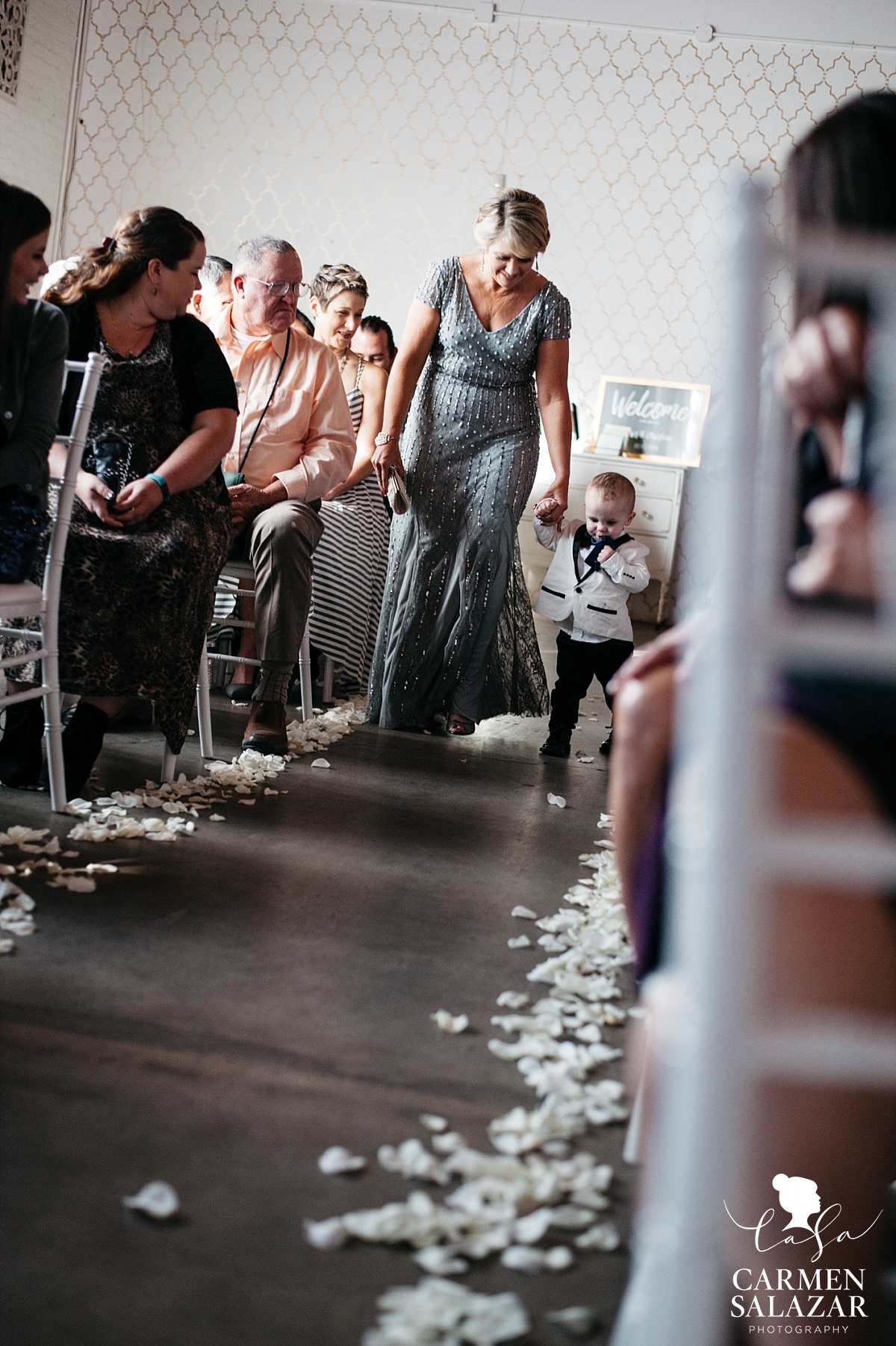 Baby of the bride and groom walking the aisle - Carmen Salazar