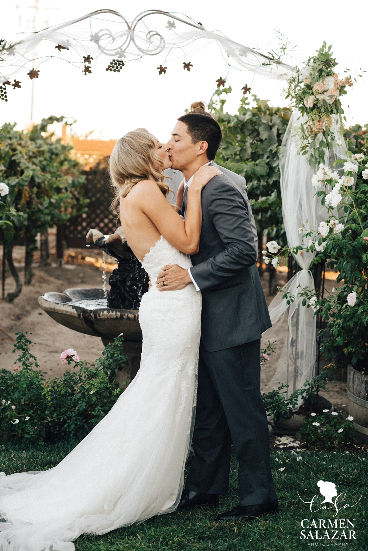 Bride and groom first kiss at Scribner Bend ceremony - Carmen Salazar