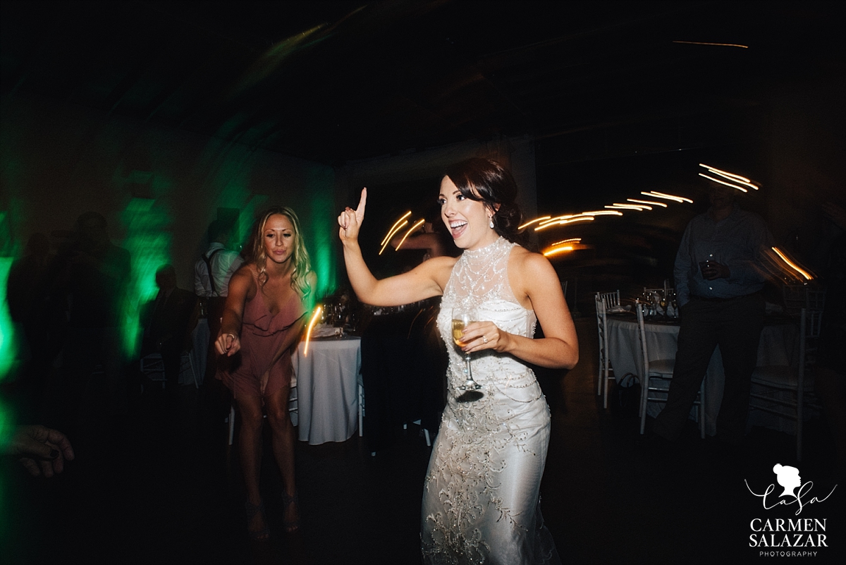 Bride dancing with wine at Studio 817 - Carmen Salazar