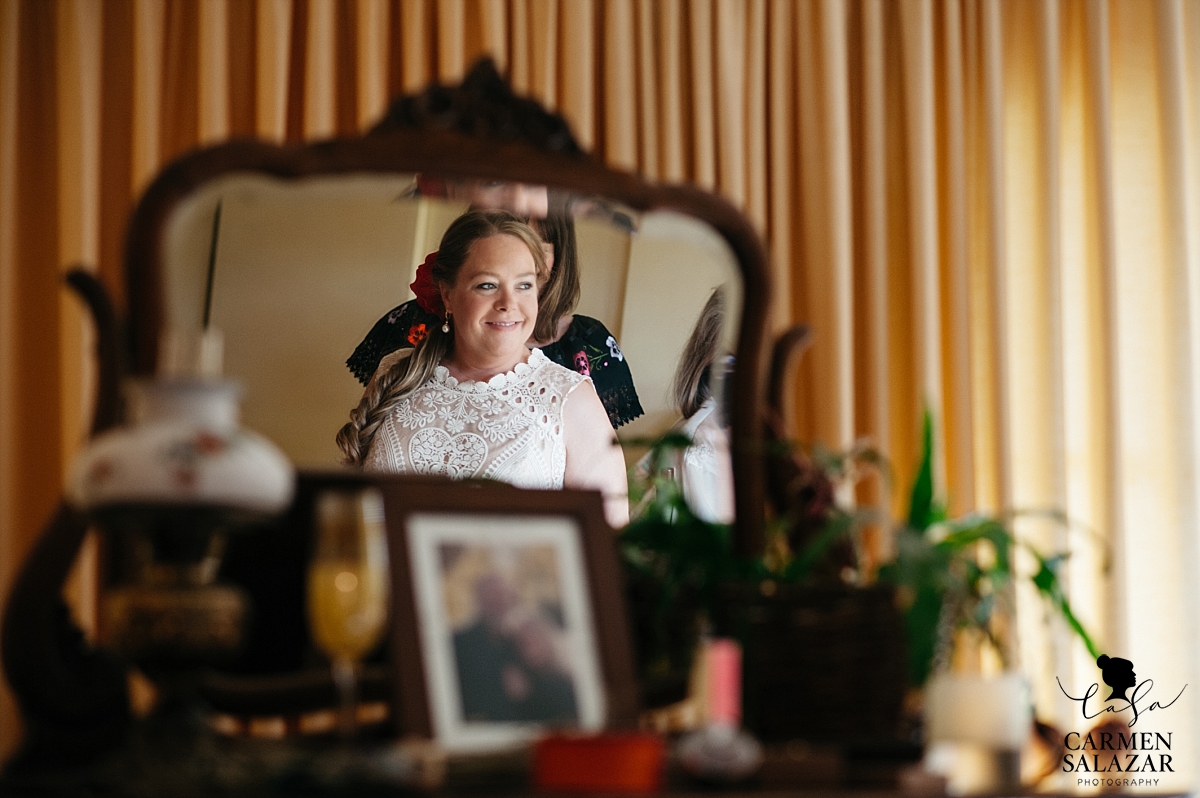 Bride putting on BHLDN dress at private estate - Carmen Salazar