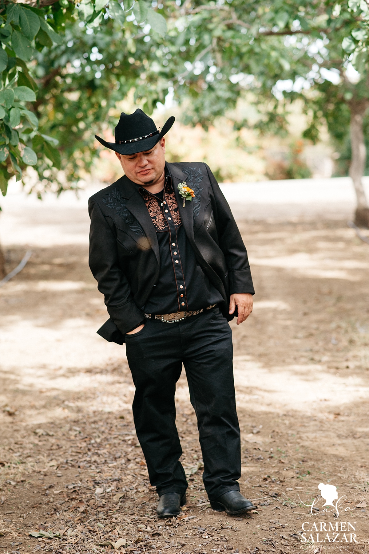 Groom waiting in Winters orchard for first look - Carmen Salazar