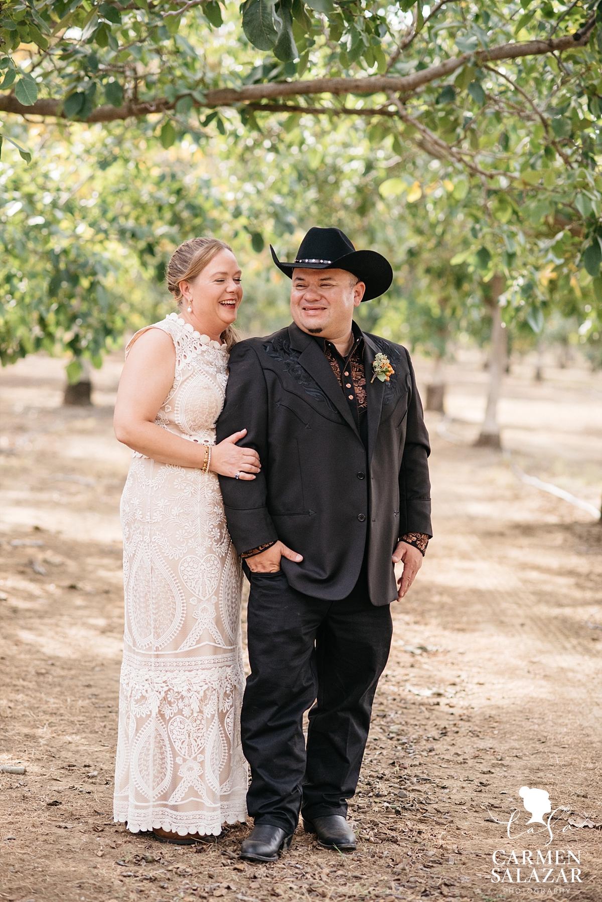 Laughing bride and groom at farm first look - Carmen Salazar