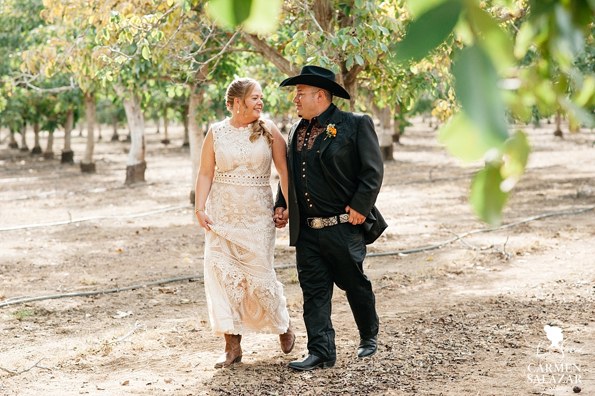 Bride and groom holding hands at Winters wedding - Carmen Salazar