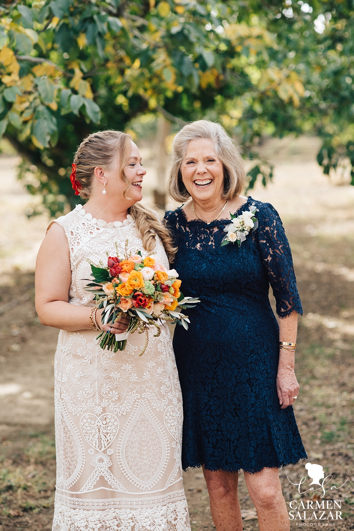 Bride laughing with her mom at family farm - Carmen Salazar