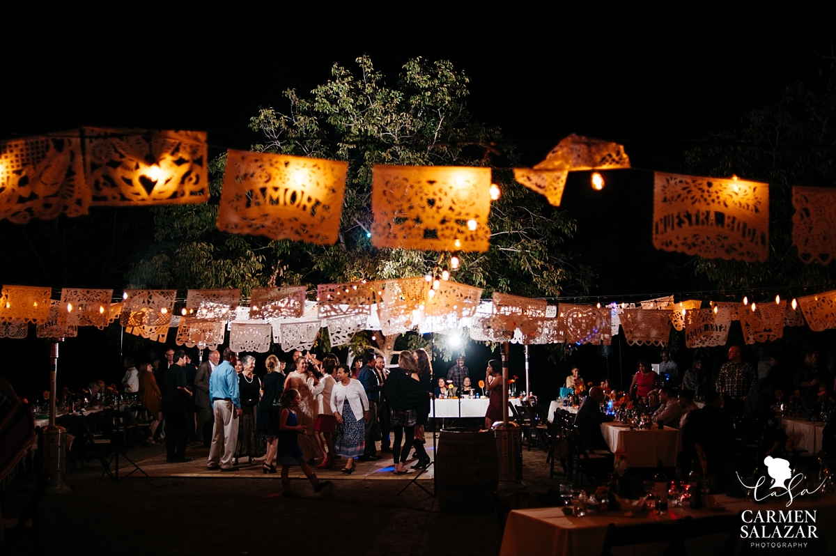 Night dance floor with papeles at farm wedding - Carmen Salazar