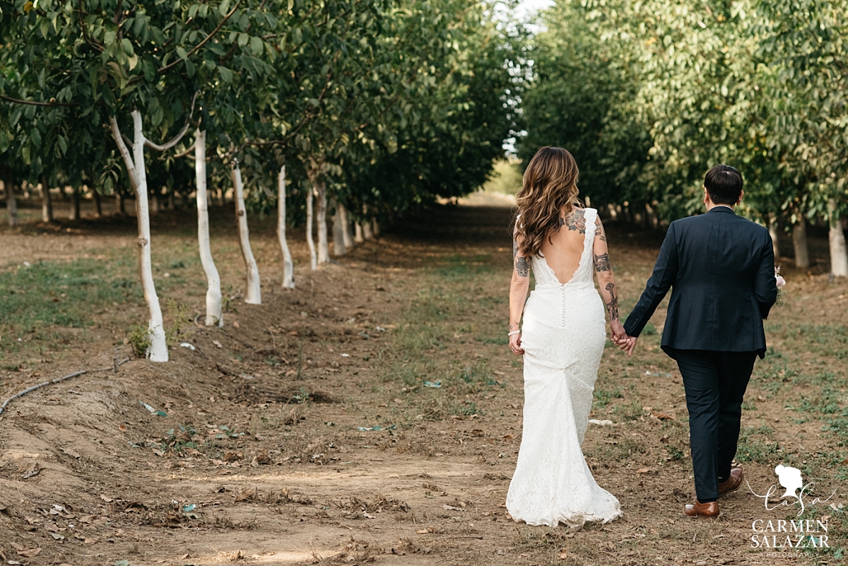 LGBT couple walking to wedding reception - Carmen Salazar