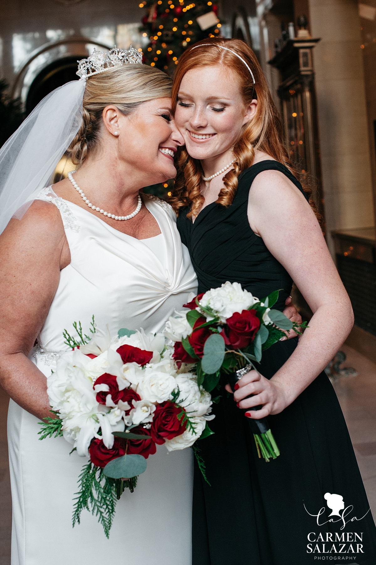 Bride hugs daughter junior bridesmaid - Carmen Salazar