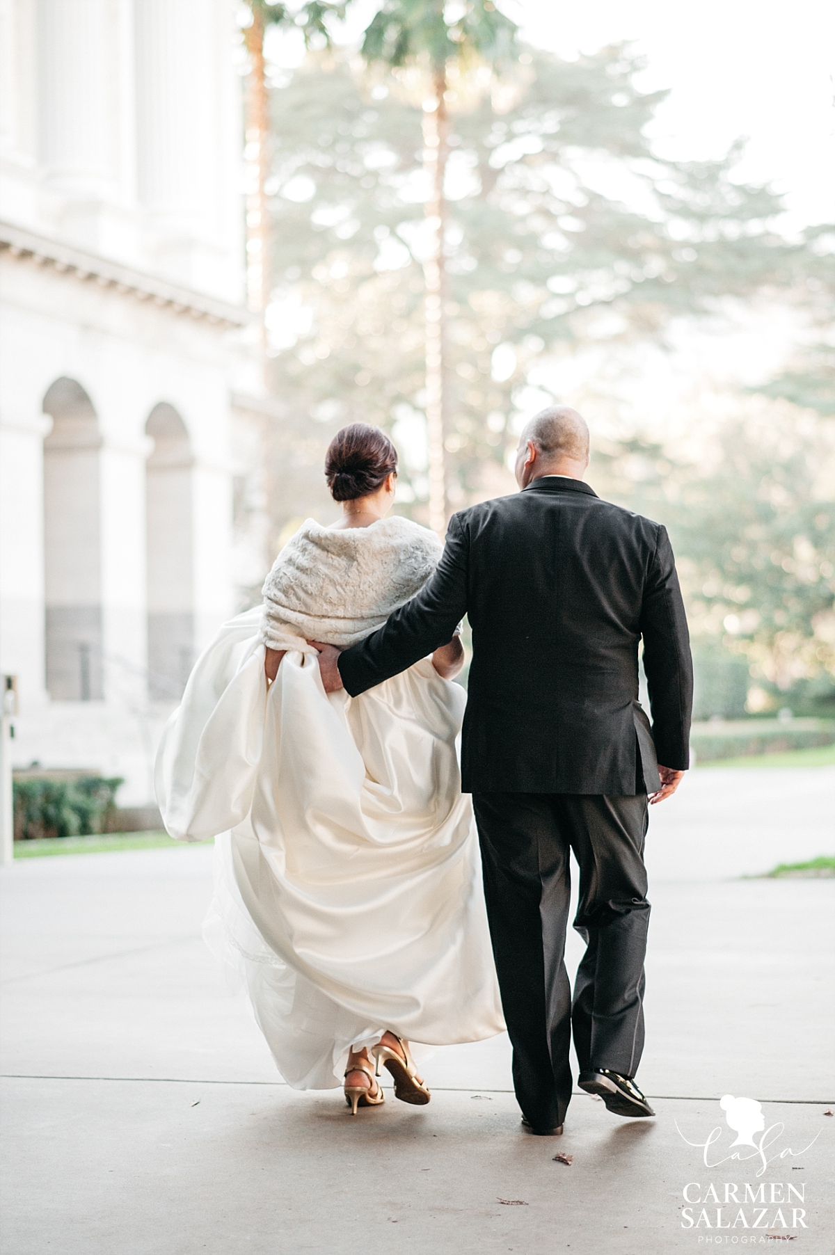 Bride and groom walk at Capitol Park - Carmen Salazar