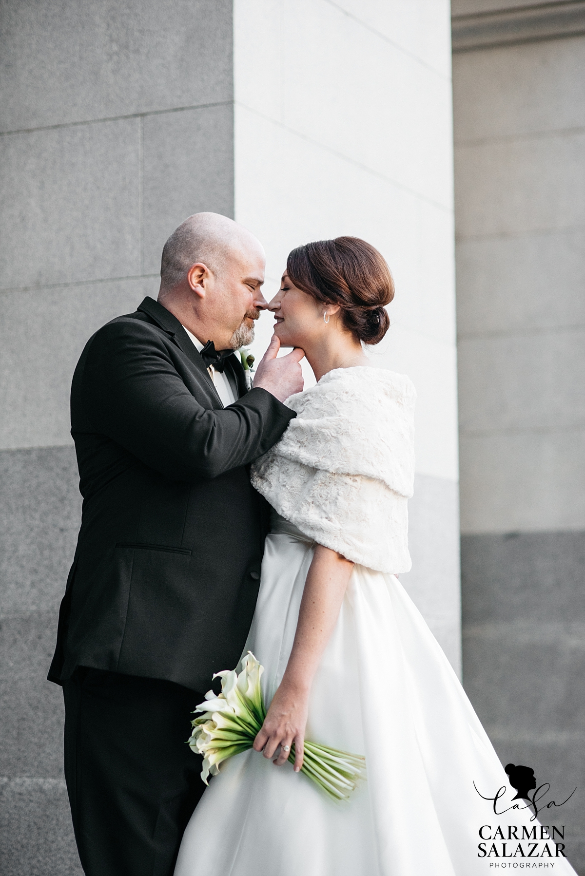 Bride and groom lovingly embrace - Carmen Salazar